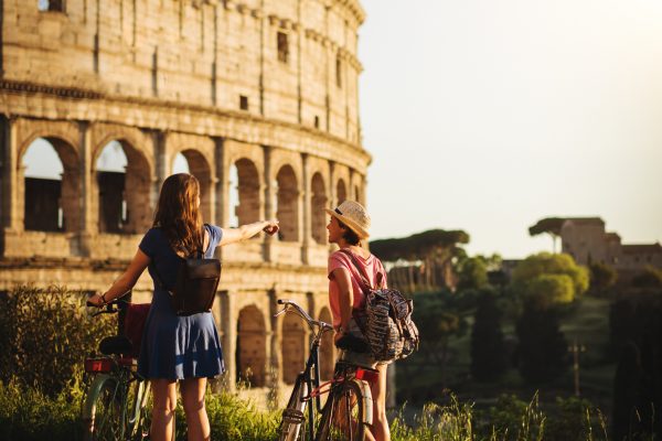 Tourist women in Rome: by the Coliseum.
The red guide book is a stunt fake guide made with my own pictures. PR attached.