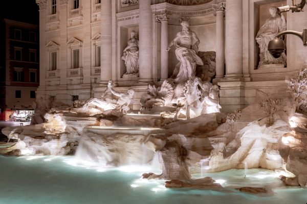 Trevi Fountain or Fontana di Trevi at night, Rome, Italy. Beautiful baroque fountain decoration. Nice illumination of the famous fountain at dusk.