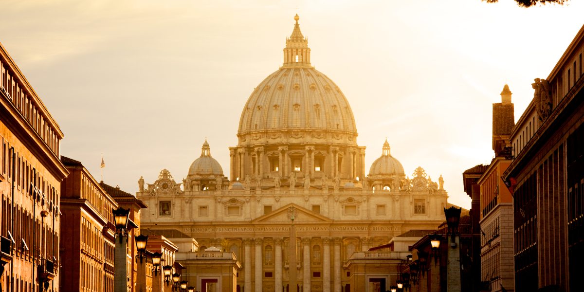 Vatican City, Vatican City State - August 21, 2008: St. Peter's Basilica at sunset from Via della Conciliazione. Vatican City State. Rome, Italy.